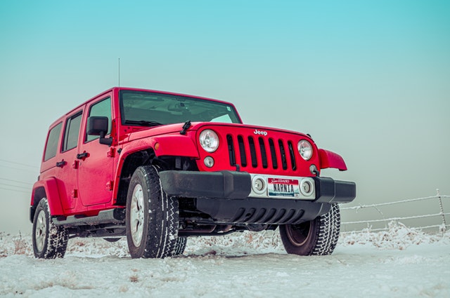 red jeep with Arctic Claw winter tires